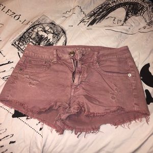 Pink denim ripped mini shorts
